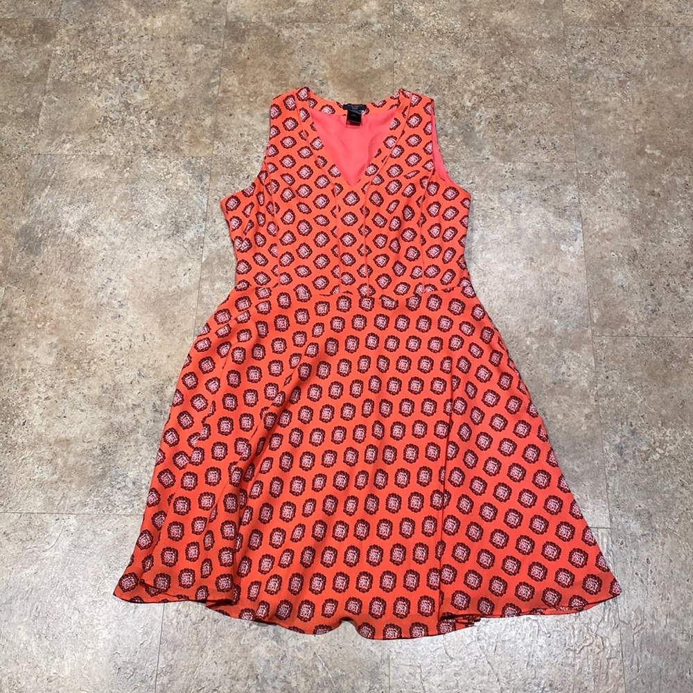 Coral dress with navy, light blue, white pattern